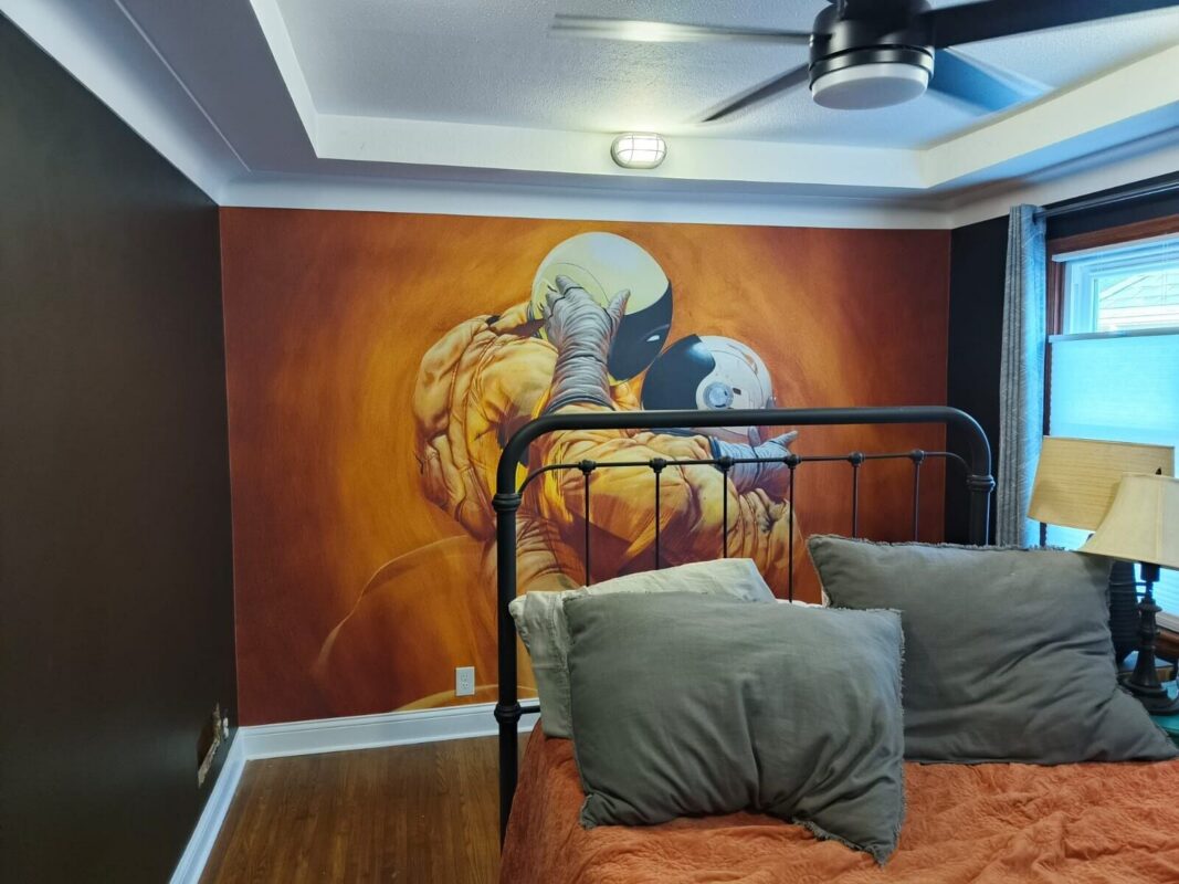 Custom comic-style superhero mural wallpaper installed as a bedroom accent wall in Lebanon