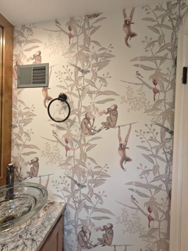 Custom jungle monkey pattern wallpaper installed in a Lebanon bathroom